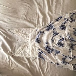 White dress with low neck and blue flowers